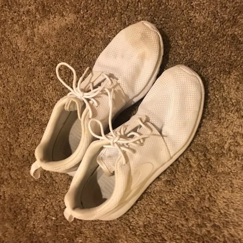 All white Nike  Roshe runs